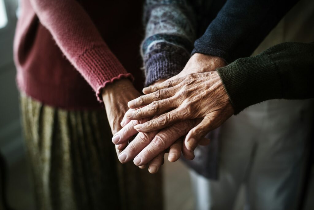 Closeup of hands of group of seniors